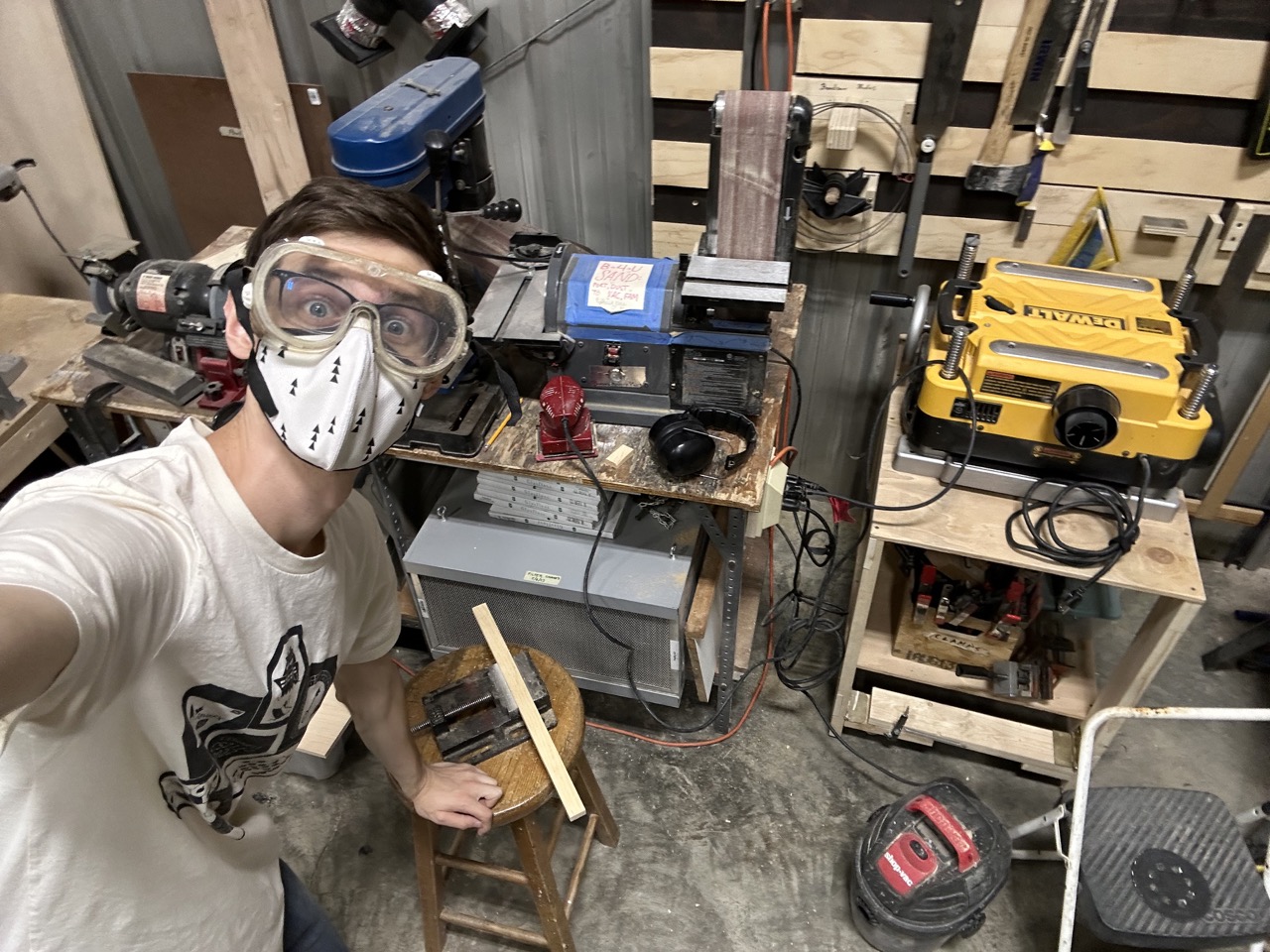 The first photo I took in the shop! Here I'm sanding one of the edges of the tray. The mask and goggles really help keep the sawdust out of my face.